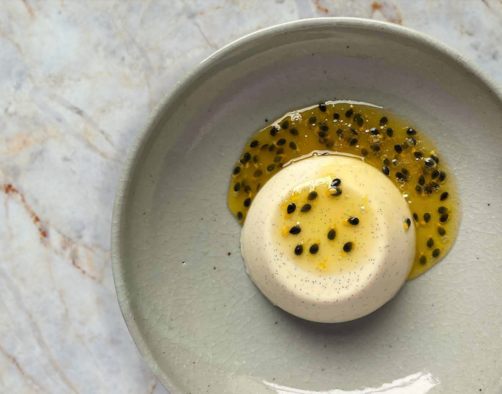 White Chocolate & Hazelnut Panna Cotta with Passionfruit Coulis
