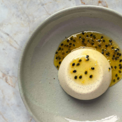 White Chocolate & Hazelnut Panna Cotta with Passionfruit Coulis